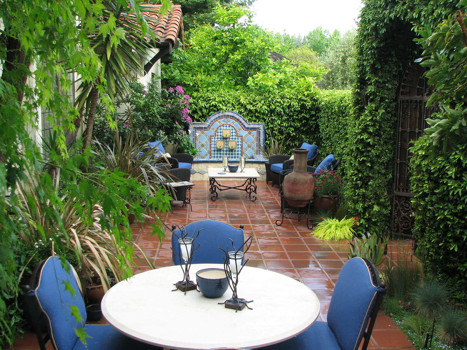 Saltillo tile courtyard with accent fountain and tropical vibe