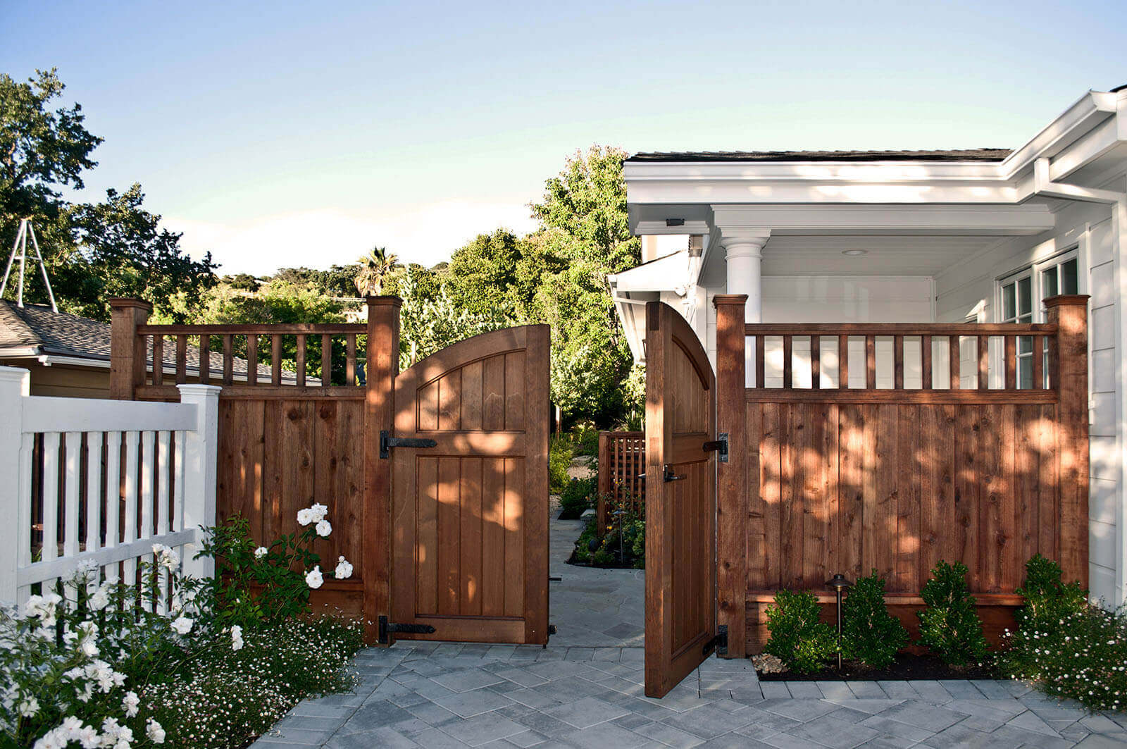 red wood border gate with double door entryway