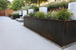 Corten steel planters create structure in a contemporary landscape by J. Montgomery Designs