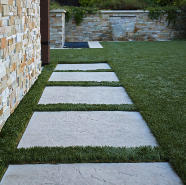 Contemporary pavers lead through lawn