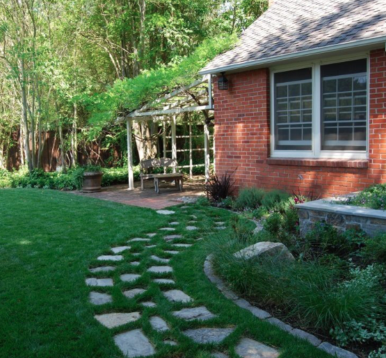 Traditional landscape with flagstone path through lawn