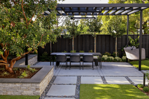 contemporary dining area with louvered pergola and California native planting