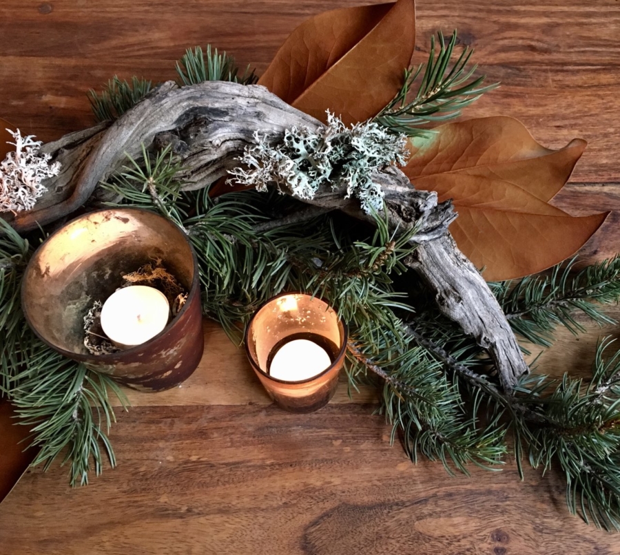Winter candle arrangement with Evergreen branches and earthy tones