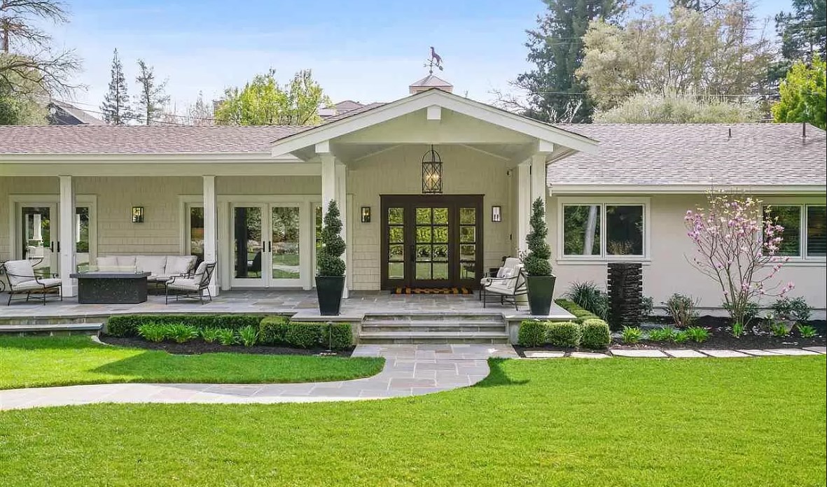 Timeless Spring entry curb appeal with lush lawn topiaries