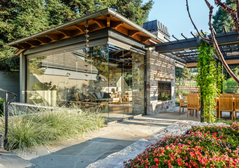 Glass-walled sunroom in a contemporary landscape