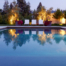 Full-scale pool with Baja shelf reflects lounges, elegant modern planters and landscape lighting