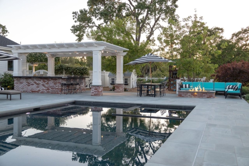 sand pit for kids to play in next to the pool